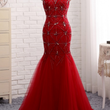 The Red Dress Is Deep In The Neck Of The Long..